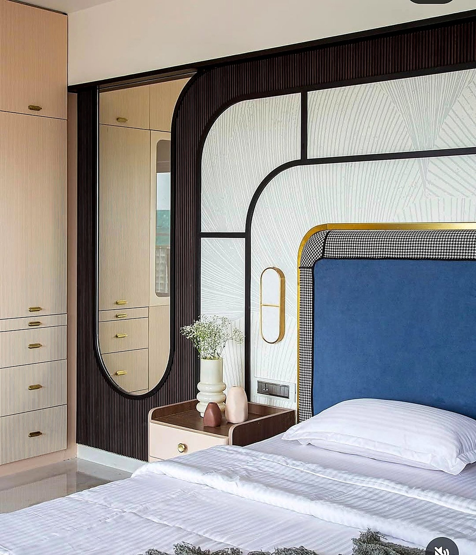 Bedroom with an arched walnut wall